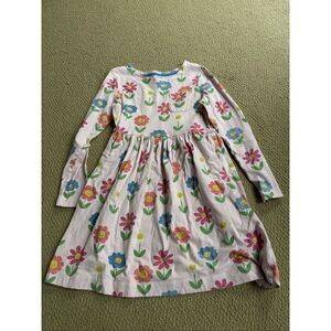 Mini Boden Kids' long sleeve cotton jersey dress with a smiling floral print 11-